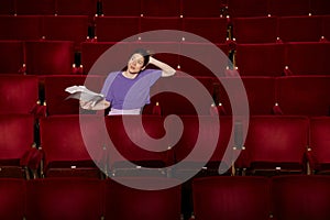 Woman With Script At Theatre Stall