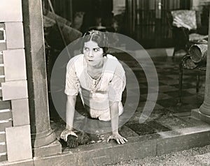 Woman scrubbing the floor photo