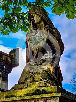A woman sculpture in the 'PÃ¨re Lachaise' Cemetery in Paris, France photo
