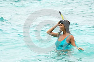 Woman in the sea during snorkeling in blue water