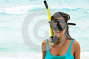 Woman in the sea during snorkeling in blue water