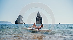 Woman sea sup. Close up portrait of happy young caucasian woman with blond hair looking at camera and smiling. Cute