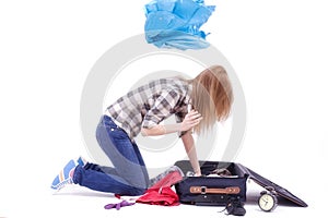 Woman searching in a travel bag