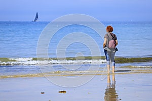 Redhead woman on the seashore photo