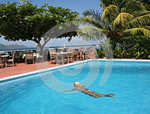 Woman in seaside swimming pool .