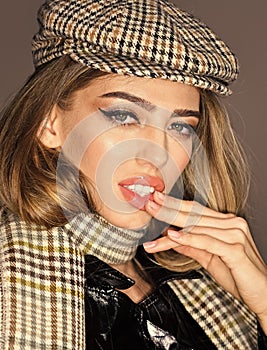 Woman on seductive face with make up with checkered accessories. Fashion accessories concept. Girl with long hair wears