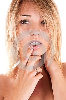 woman seductively touching finger to lips