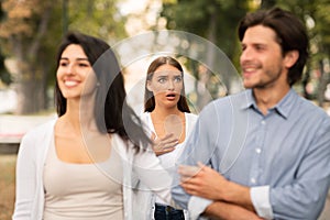 Woman Seeing Cheating Boyfriend Dating With Other Girl In Park