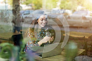 Woman seen through cafe window