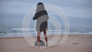 Woman seen dancing at the beach