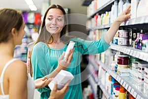 Woman selecting cosmetical cream