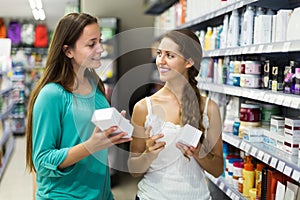 Woman selecting cosmetical cream