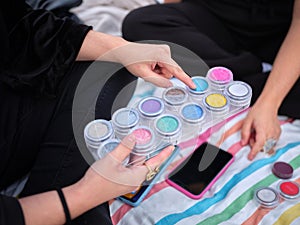 woman selecting the paint sample with which she is going to characterize photo
