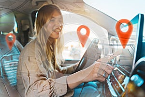 Woman selects the destination with car gps navigator