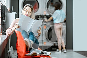 Woman in the self-service laundry