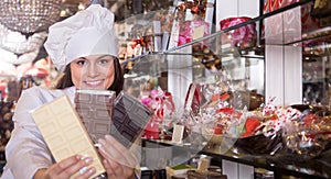 Woman selling chocolates and confectionery