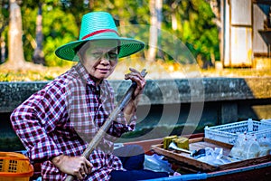 Woman selling Floating Market Thailand