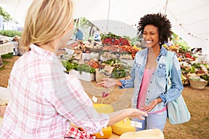 Woman Selling Fresh Cheese At Farmers Food Market