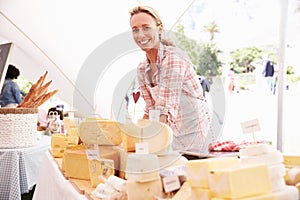 Woman Selling Fresh Cheese At Farmers Food Market