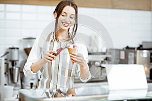 Woman selling ice cream in the shop