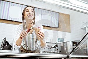 Woman selling ice cream in the shop