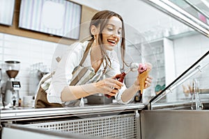 Woman selling ice cream in the shop