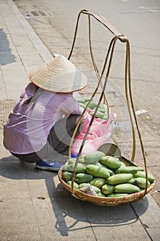 Woman selling mangos photo