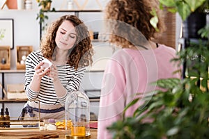 Woman selling organic skincare products photo