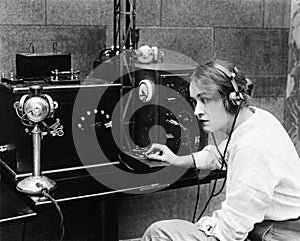 Woman sending Morse code using telegraph photo