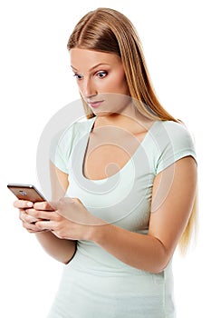 Woman sending a sms on cell phone, isolated on white.