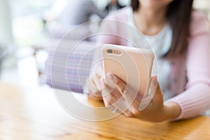 Woman sending sms on cellphone