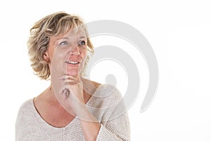 woman senior blonde middle aged beautiful mature with hand under sweet face chin looking side on white background