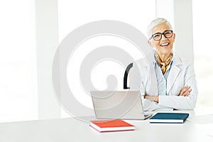 woman senior doctor hospital medical medicine health care clinic office happy smiling healthcare portrait