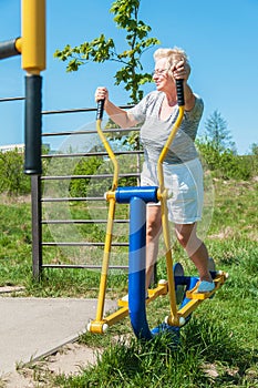 Woman senior with simulator outdoor