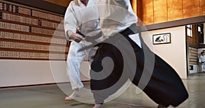 Woman, sensei and aikido fight for training, fitness and challenge with action, exercise and coaching. Teaching