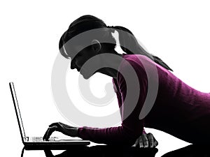 Woman serious computing laptop computer silhouette
