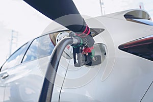 Woman service staff Handle pumping gasoline fuel nozzle to refuel