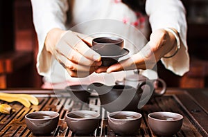 Woman serving Chinese tea in a tea ceremony