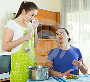 Woman serving food her man at table