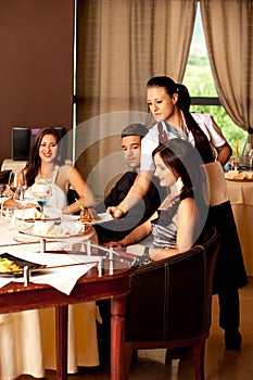 Woman serving food restaurant table