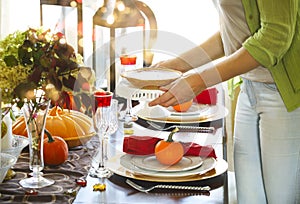 Woman serving pumpkin pie at the Thanksgiving party