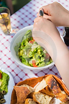 Woman serving summer salad