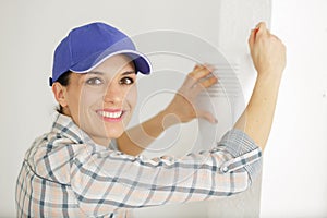 woman set thermostat at house