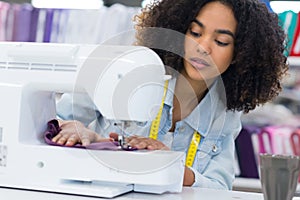woman on sewing machine