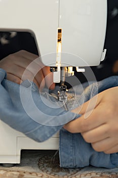 A woman sewing and repairing clothes