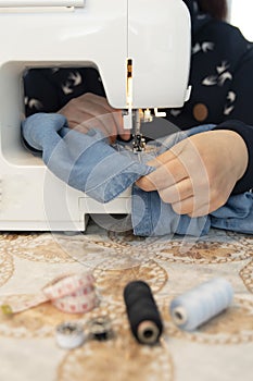 A woman sewing and repairing clothes