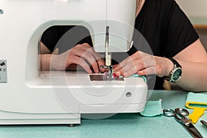 Woman sewing using a machine