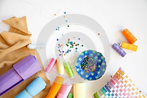 A woman sews from a cloth donuts for a children`s game. Not real