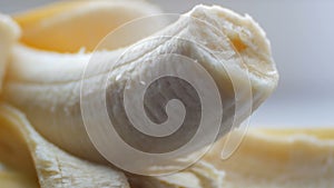 Woman sexually touching with a knife of purified banana, macro close up view