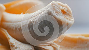 Woman sexually touching with a knife of purified banana, macro close up view